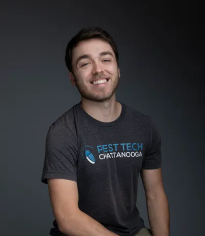 Jonathan, smiling in a Pest Tech T-shirt