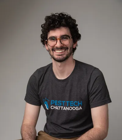 Andrew, smiling in a Pest Tech T-shirt